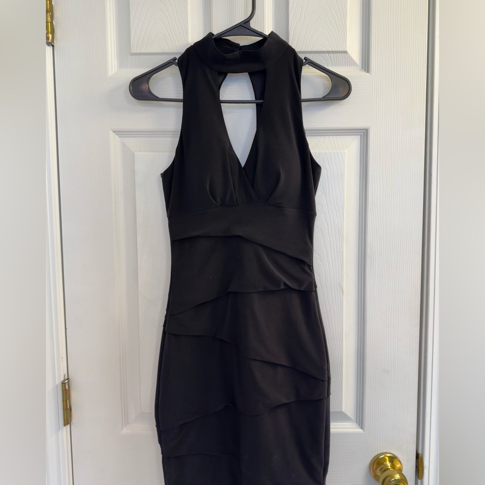 Tiered black mini dress. Keyhole high neck